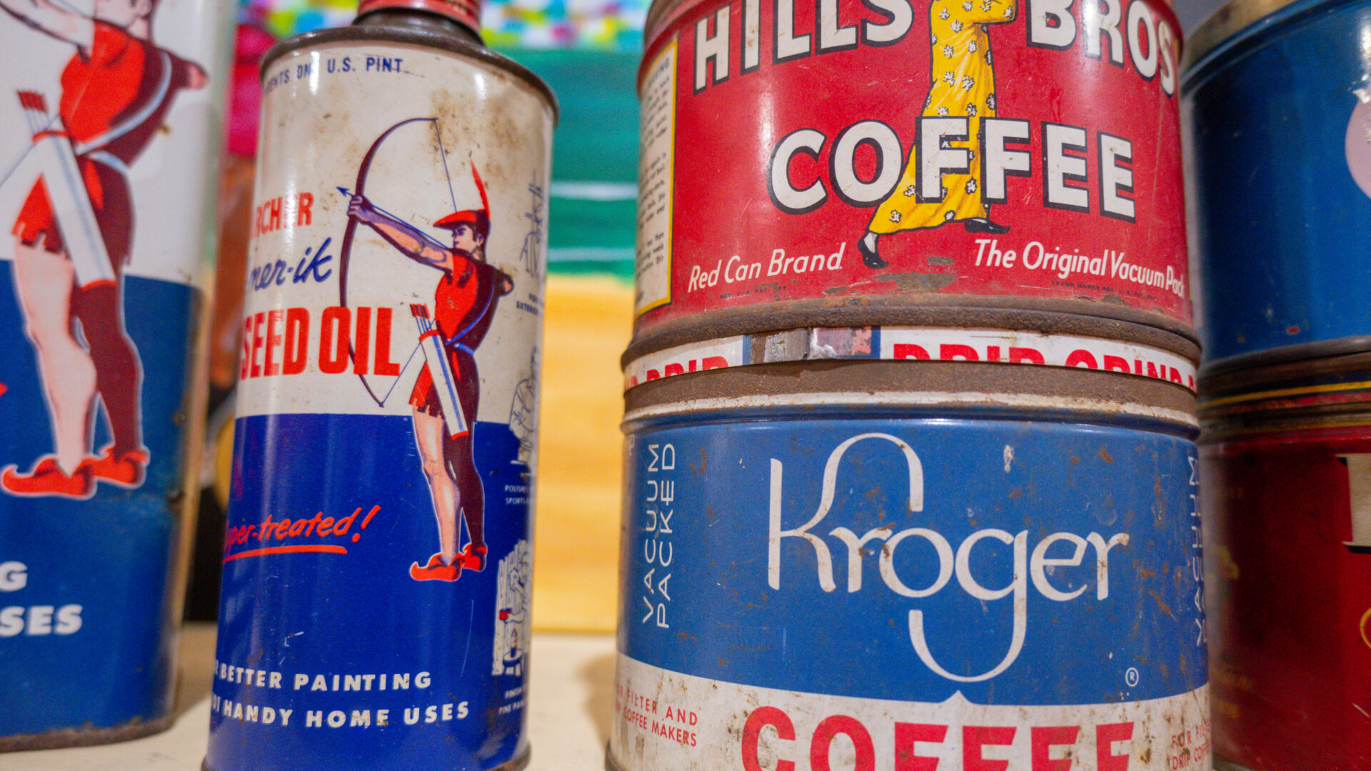 A close up of cans of coffee on the floor
